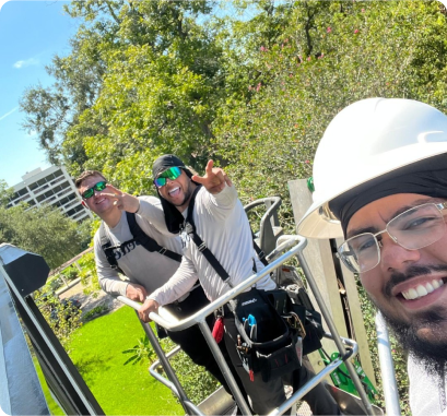 Better Exterior Workers talking a selfie while installing roller shutters