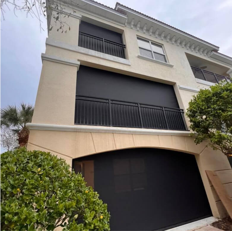 A house with Black Retractable screens installed by Better Exteriors